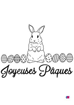Coloriage Pâques - Un lapin entouré d'œufs de Pâques